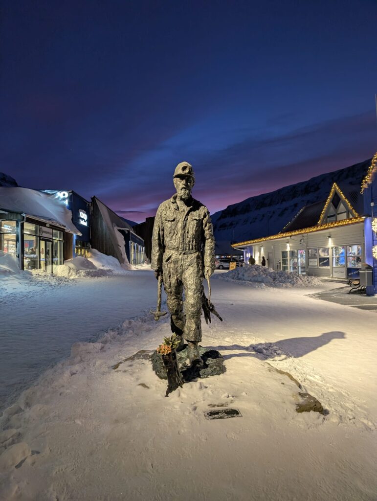 Miner Monument in snowy Longyearbyen Svalbard during Polar Night